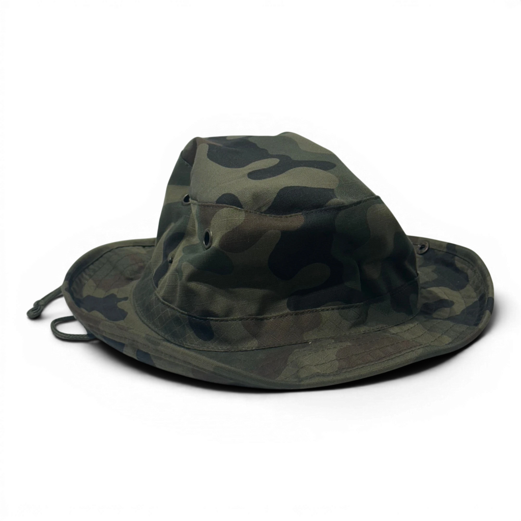 Binoklipood camouflage boonie hat with chin strap, featuring a classic bucket silhouette and wide brim for sun protection. Shades of green, brown, and black.
