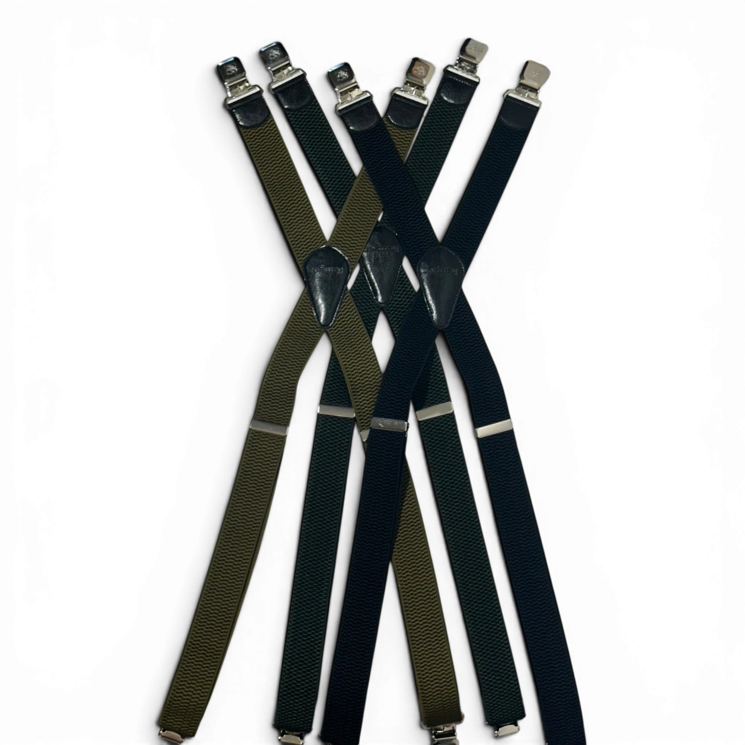 Binoklipood classic X-back suspenders in black and olive green, elastic fabric with leather accents and metal clasps.