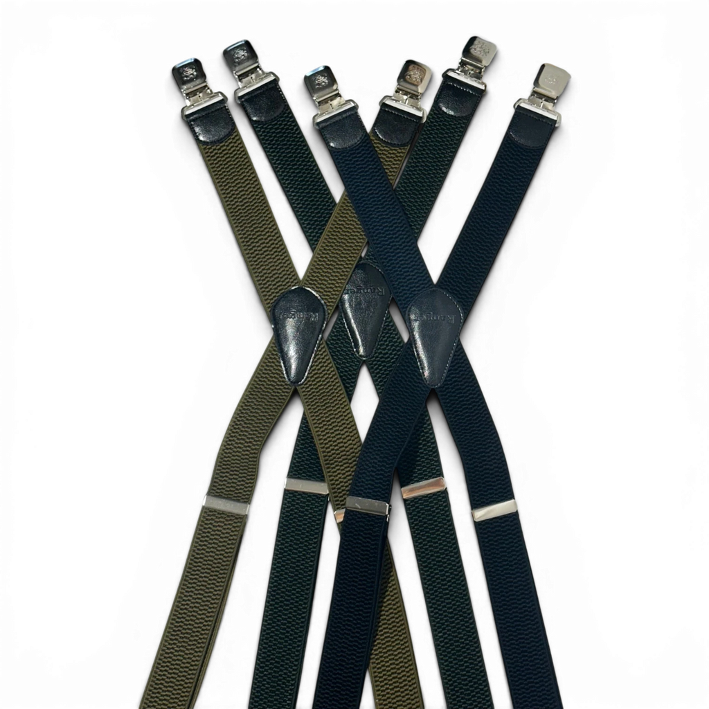 Binoklipood classic X-back suspenders in olive green and navy blue with leather accents and metal clasps.