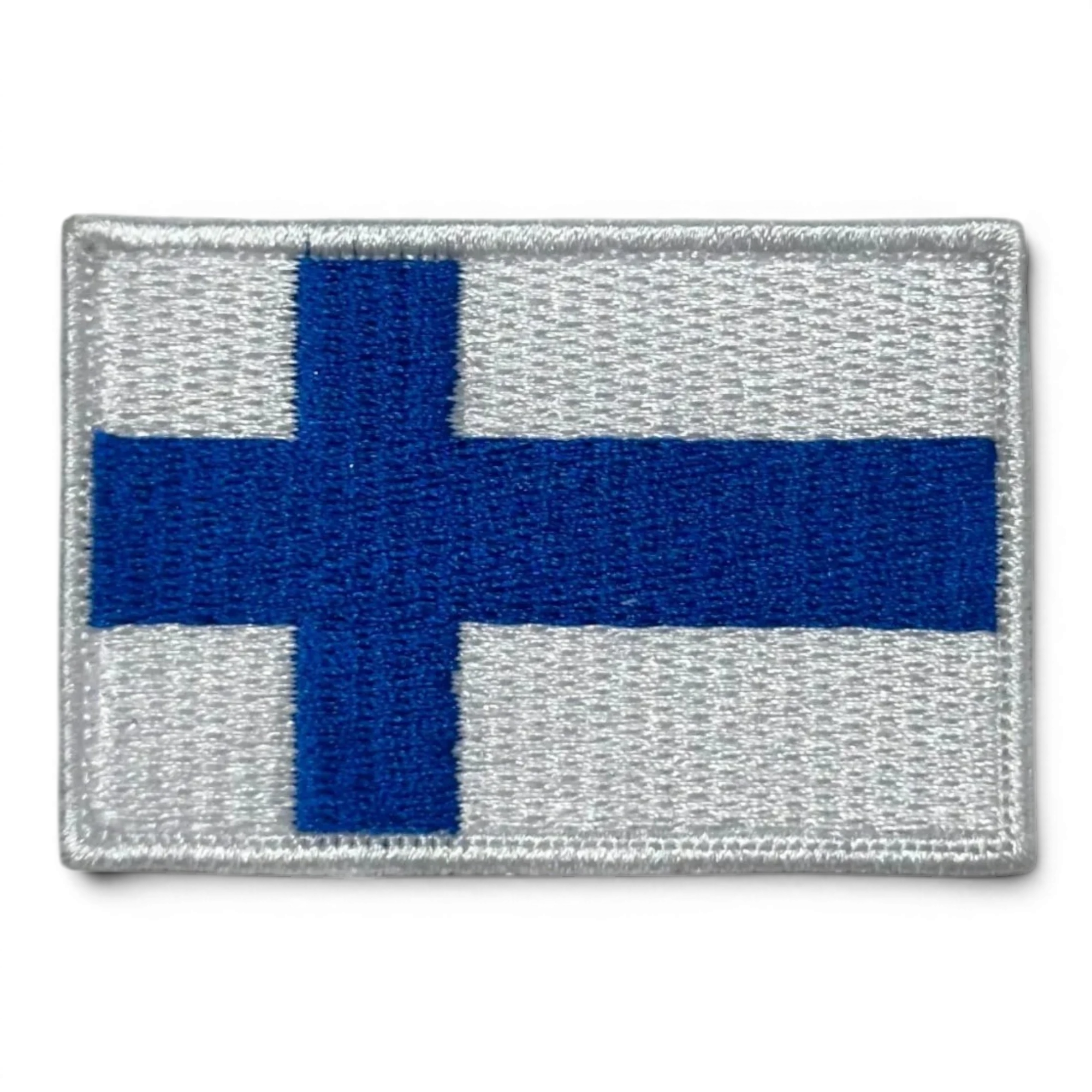 Binoklipood Finland flag embroidered patch with blue cross on white background. Durable fabric, stitched edges.
