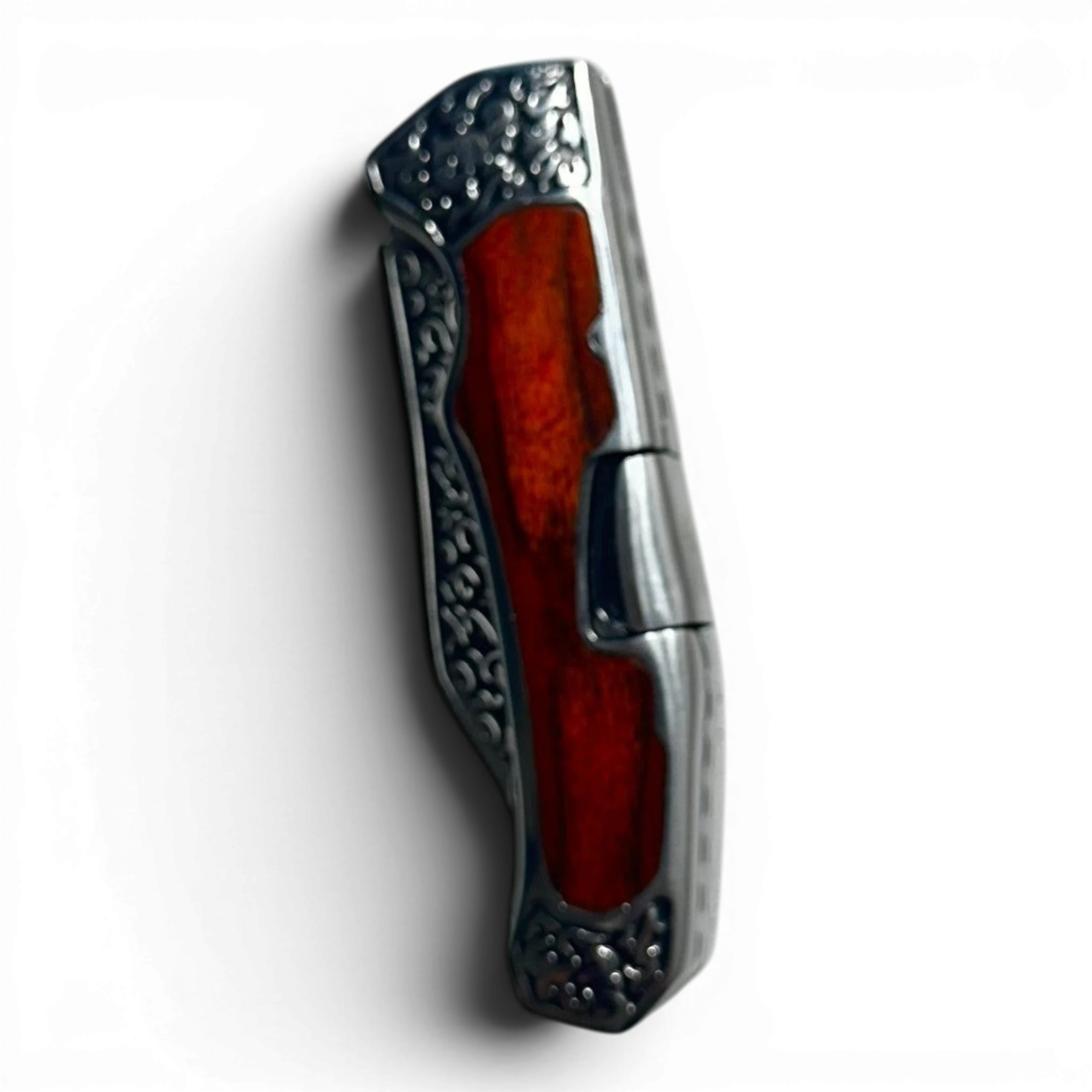 Binoklipood folding pocket knife with polished red wood handle and ornate metal bolsters. Stainless steel blade.