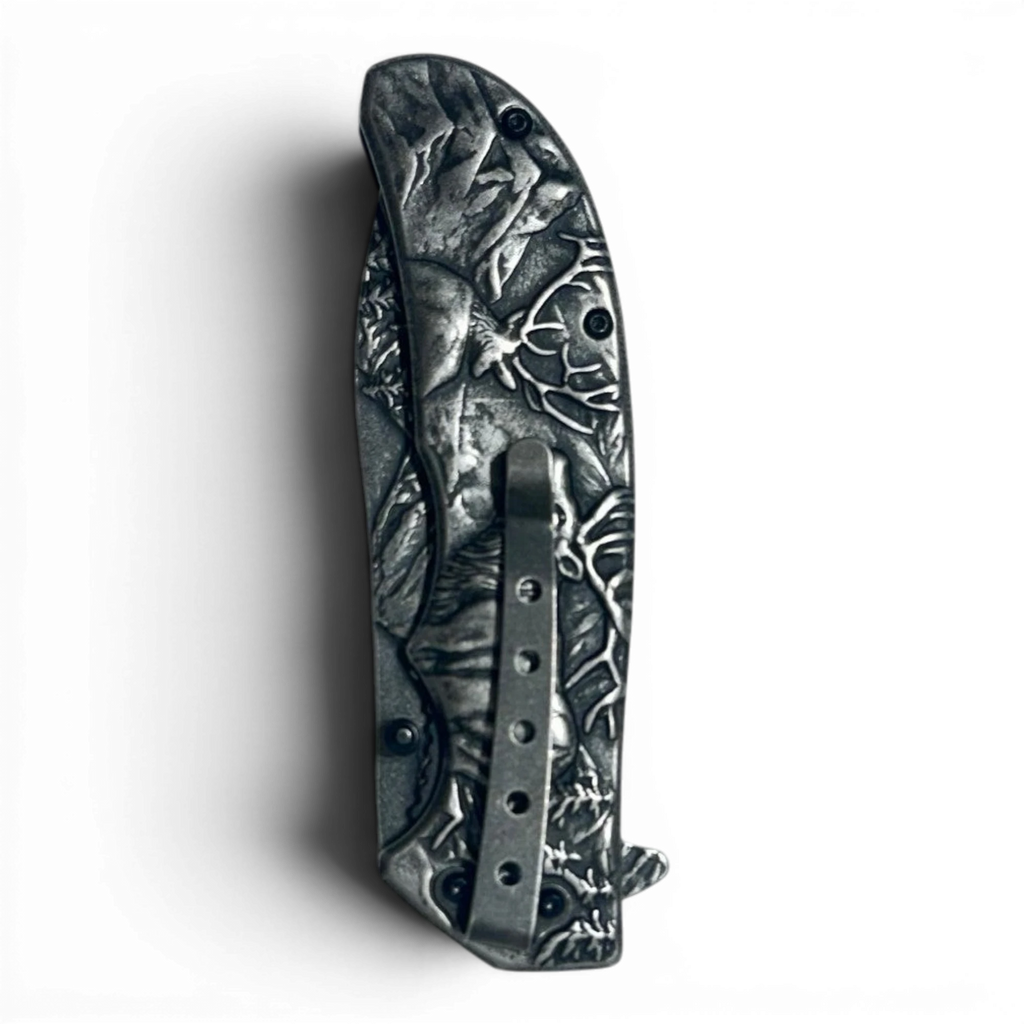 Binoklipood Ranger folding pocket knife with detailed silver handle depicting a forest scene. Metal construction.